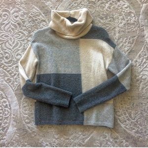 Color blocked turtleneck sweater